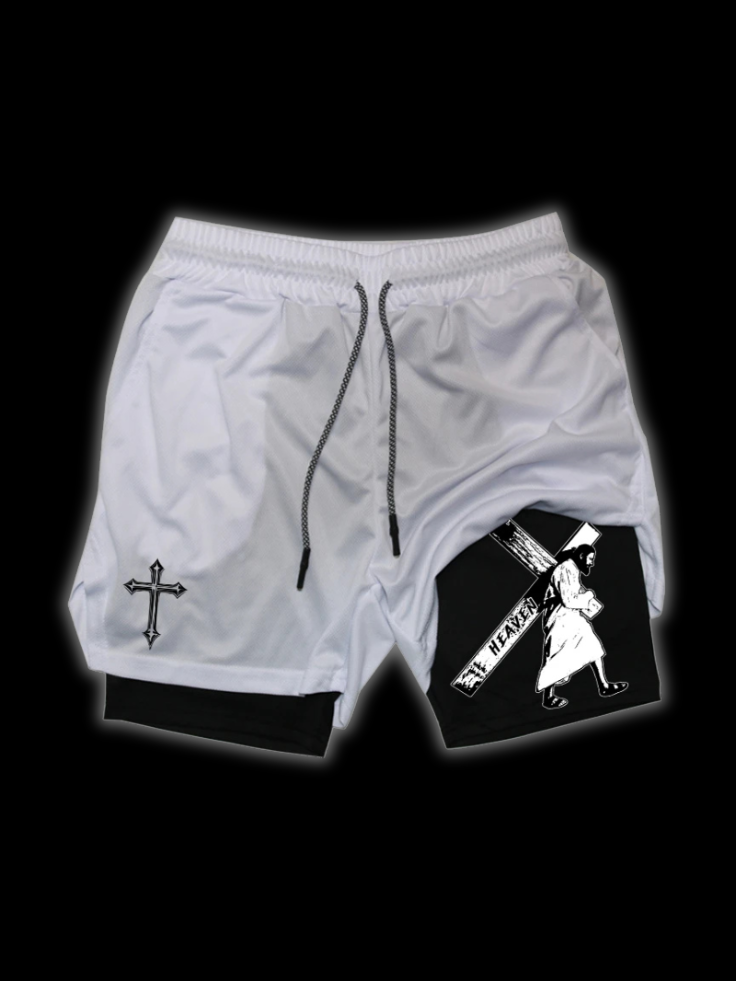 Close up front view of LuxCrux Jesus Shorts, White/Black variant on a black background