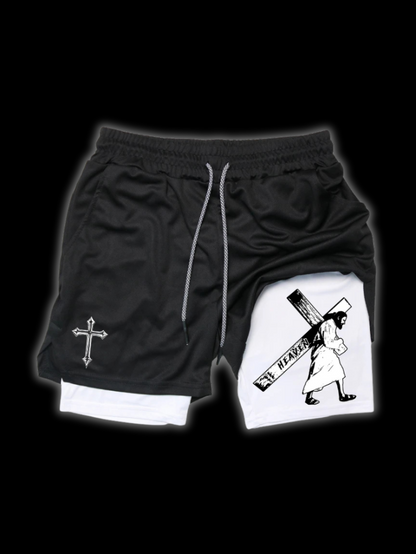Close up front view of LuxCrux Jesus Shorts, Black/White variant on a black background